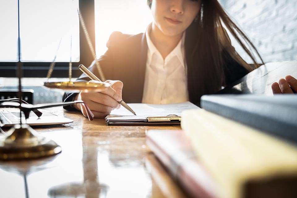 Close up lawyer businessman working or reading lawbook in office